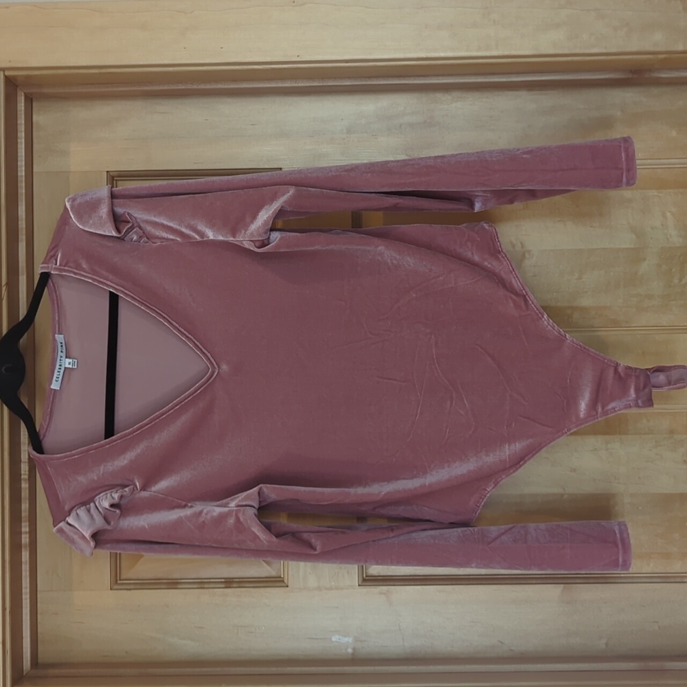 Celebrity pink velvet bodysuit with shoulder ruffle